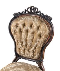 A Set of Four Rococo Revival Carved Balloon-Back Side Chairs