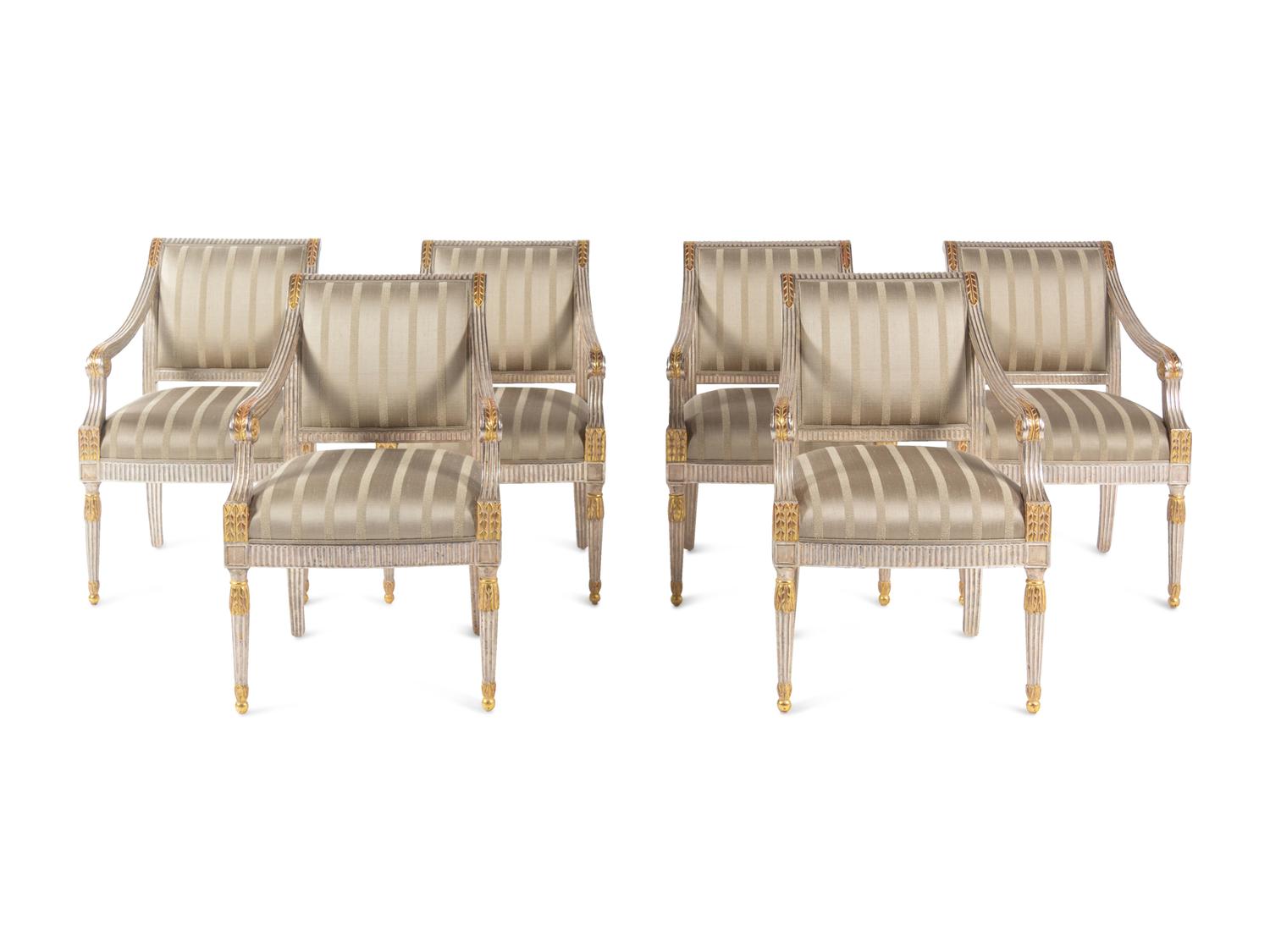 A Set of Six Neoclassical Carved and Parcel Gilt Dining Chairs