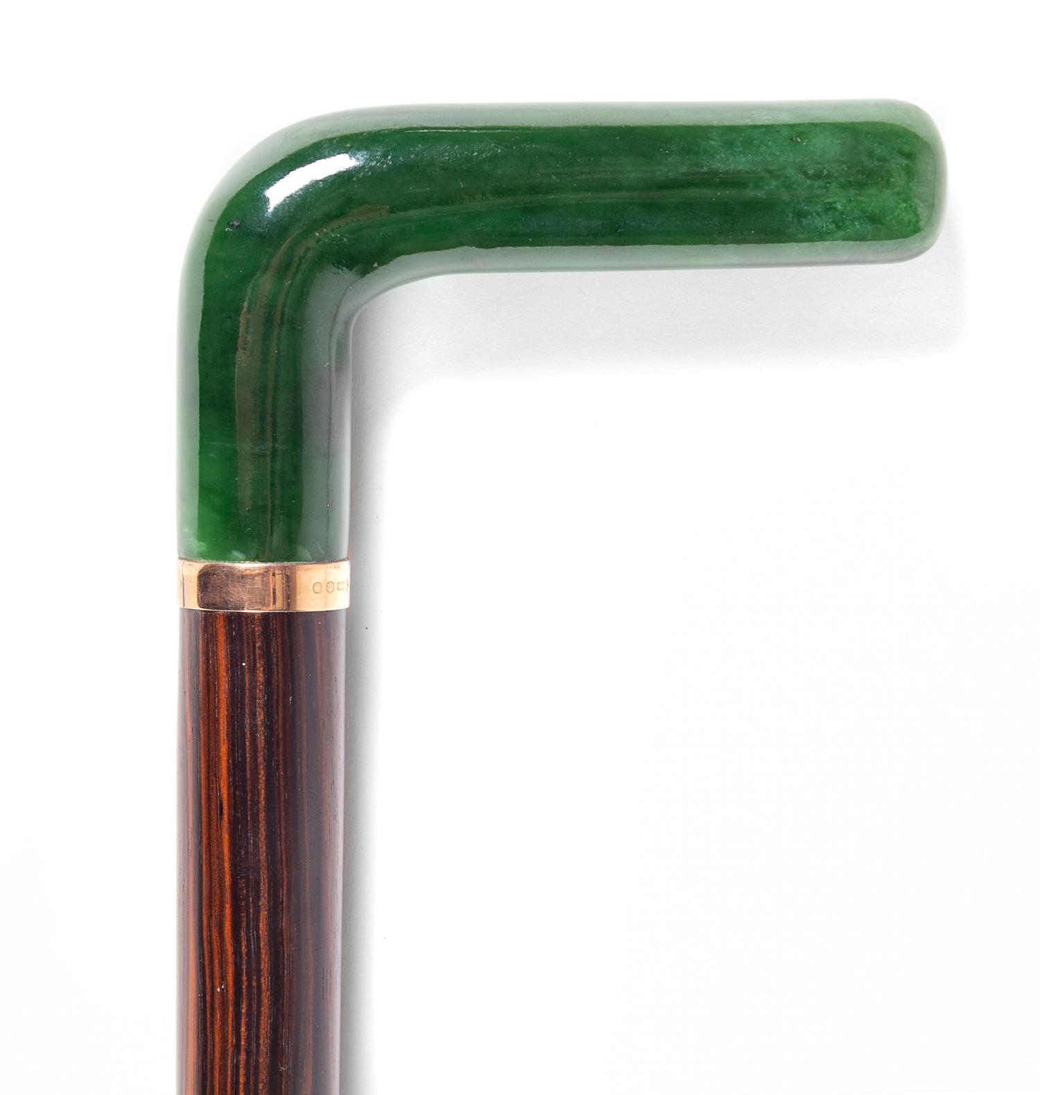 An English 9-Karat and Hardstone Mounted Cane Length 37 1/2 inches. — MAKER'S MARK BJ, LONDON, 1927