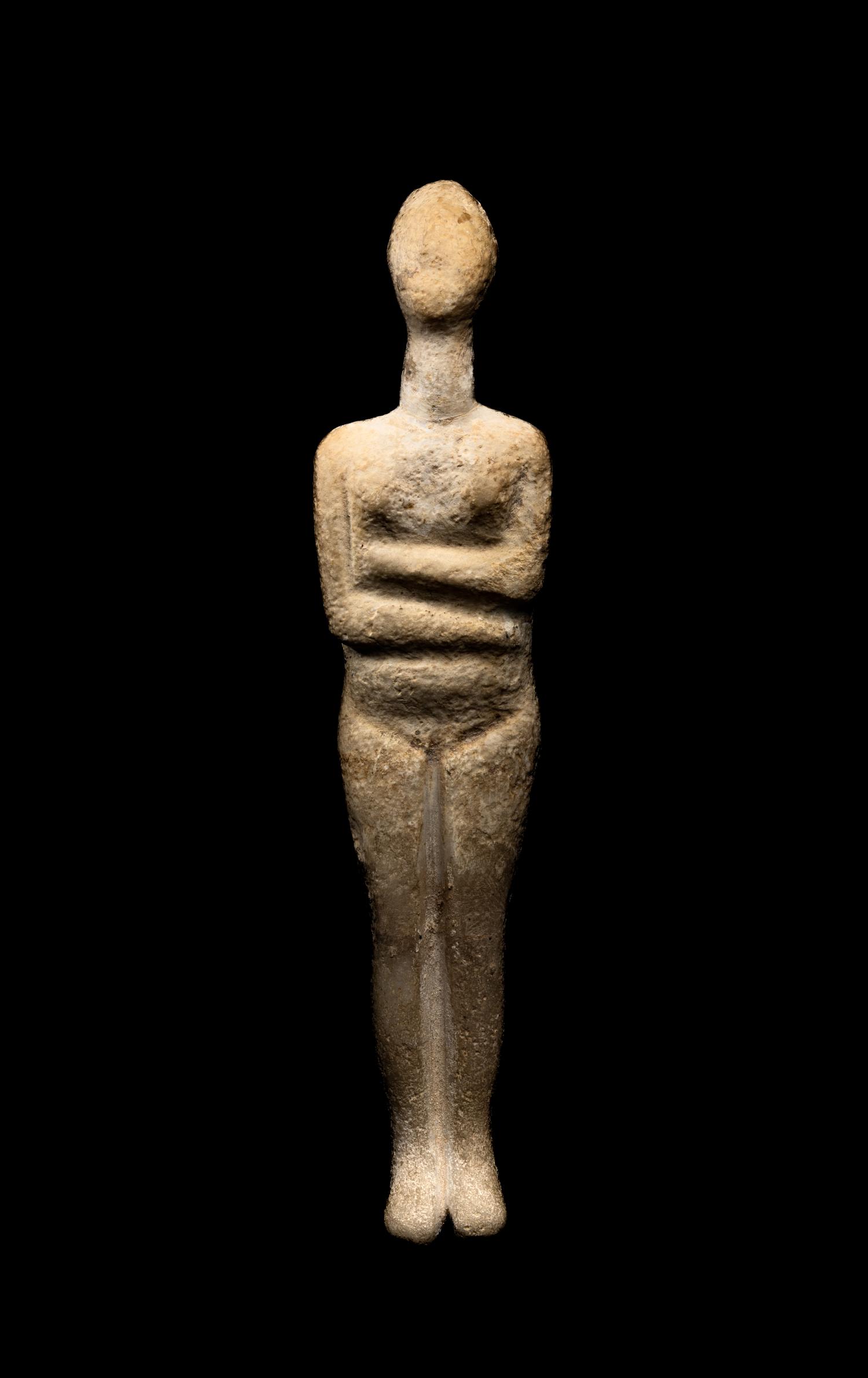 A Cycladic Marble Reclining Female Figure