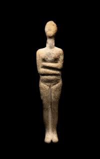 A Cycladic Marble Reclining Female Figure