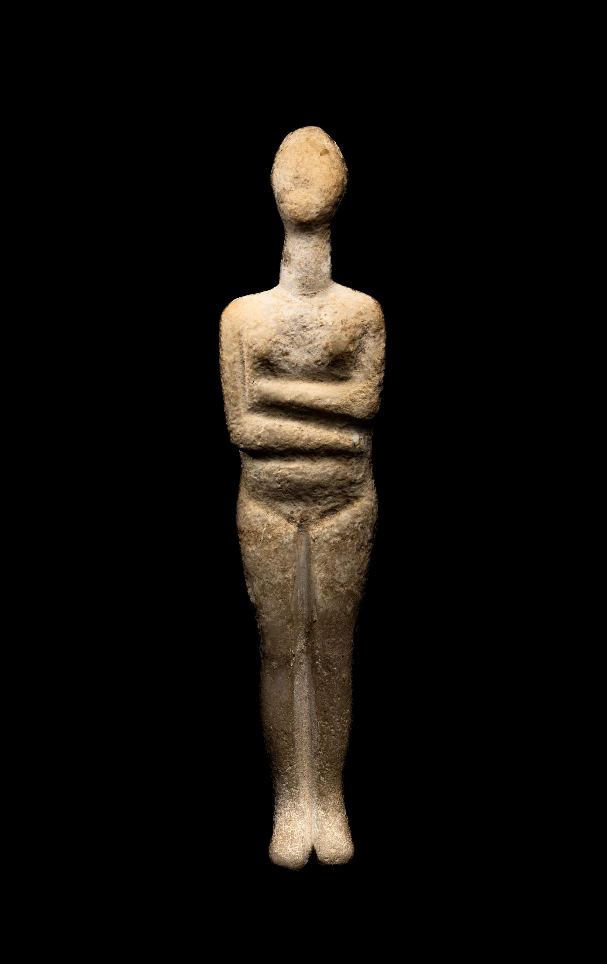 A Cycladic Marble Reclining Female Figure