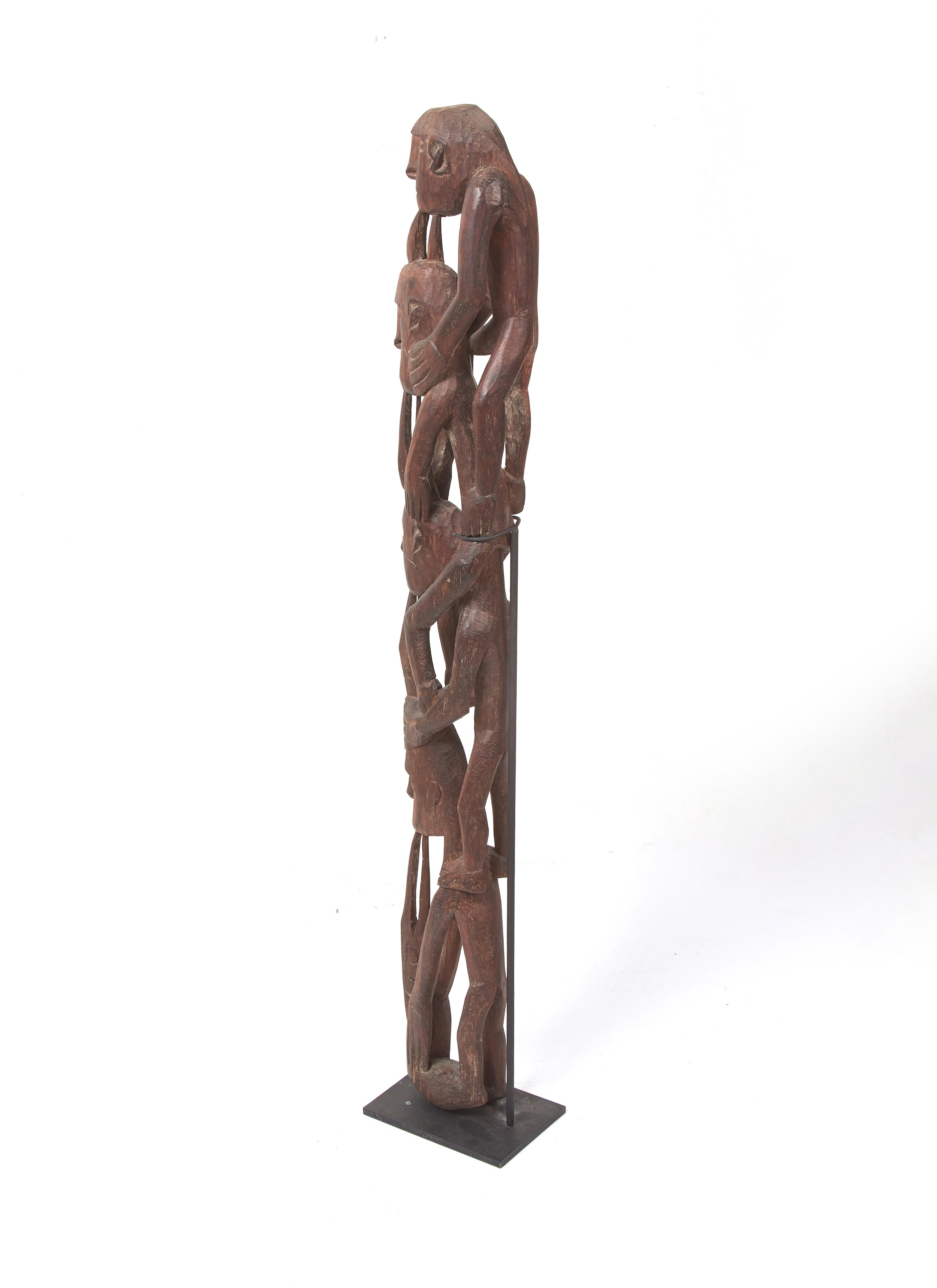 An Asmat Figure COMBINED WITH 31