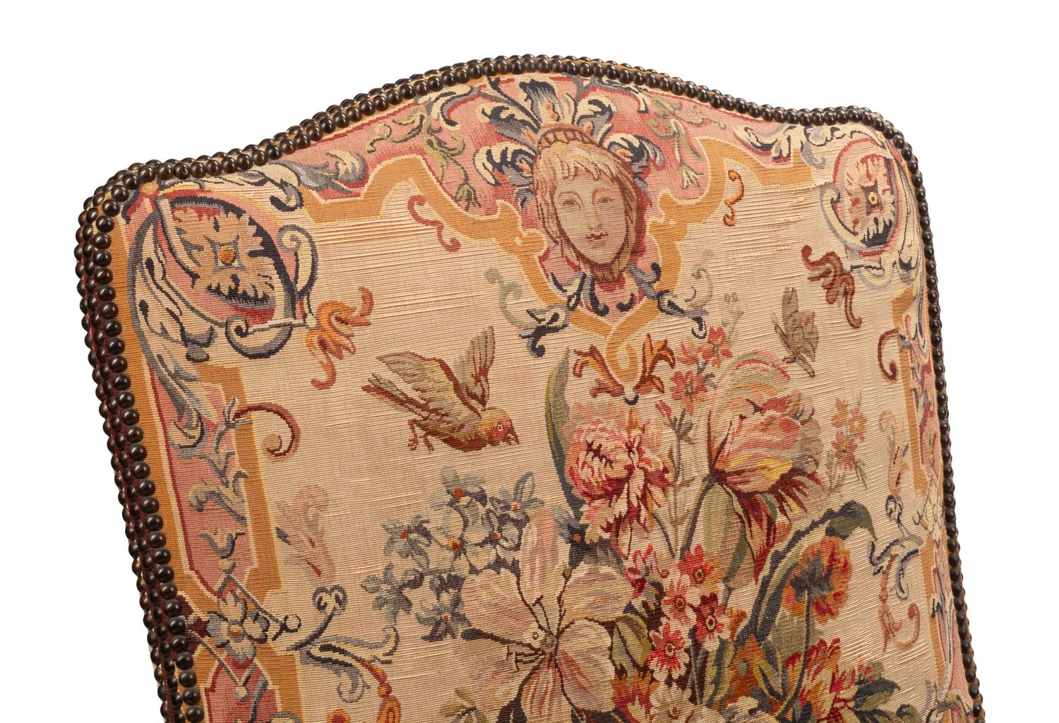 A Pair of Régence Style Carved Walnut and Tapestry-Upholstered Armchairs