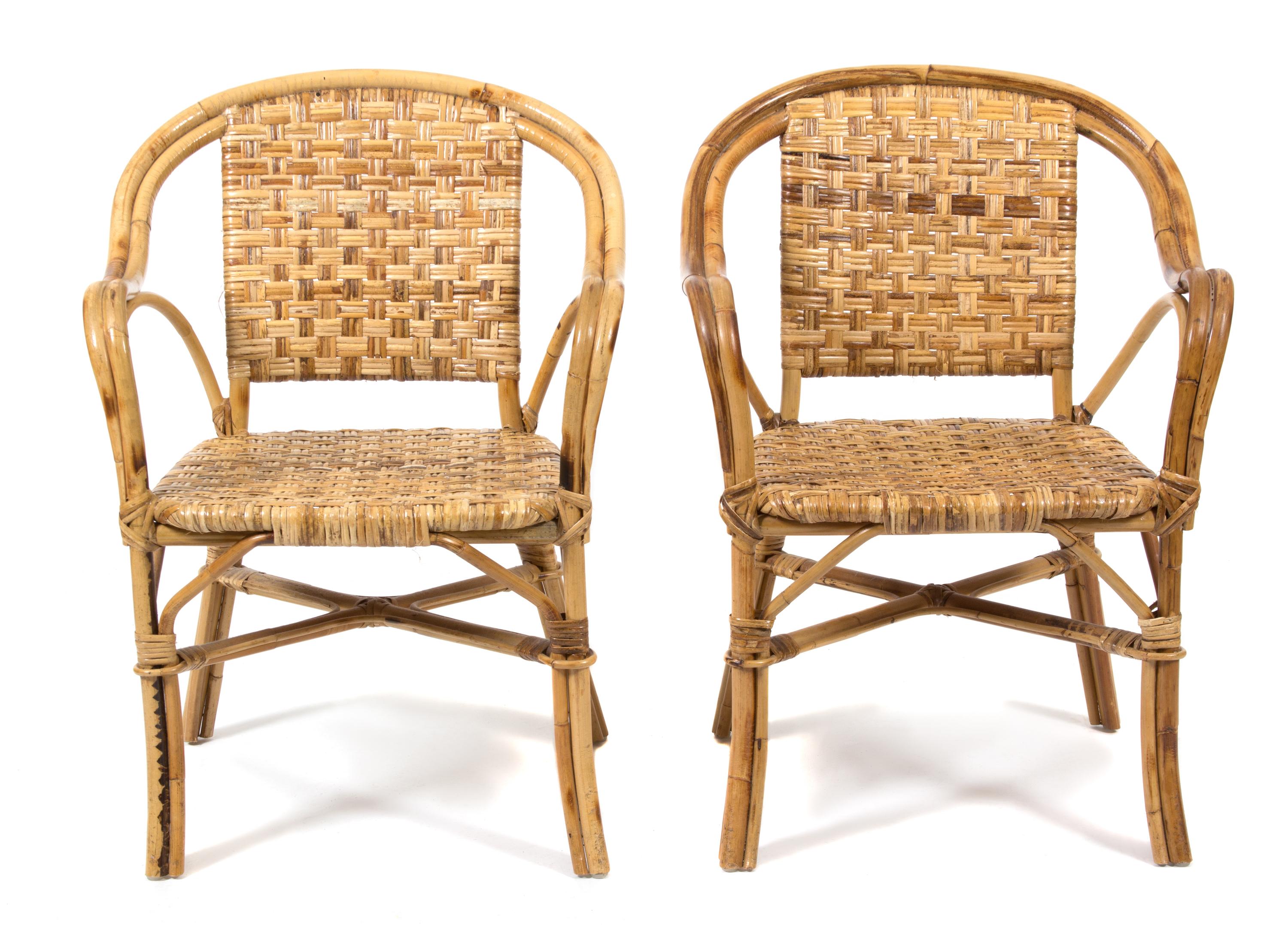 Four Rattan Open Armchairs Height 34 inches. — 20TH CENTURY