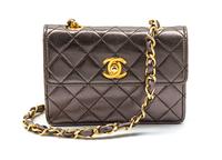 A Chanel Bronze Quilted Leather Mini Flap Bag, 5 1/2 x 4 x 1 1/2 inches.