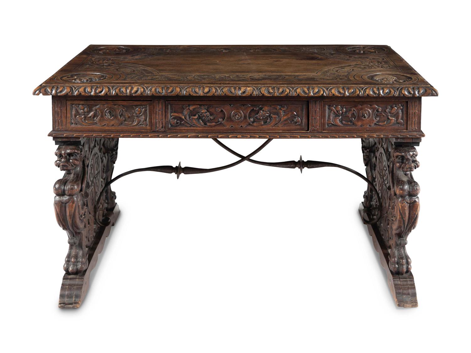 A Renaissance Revival Iron-Mounted Carved Walnut Library Table
