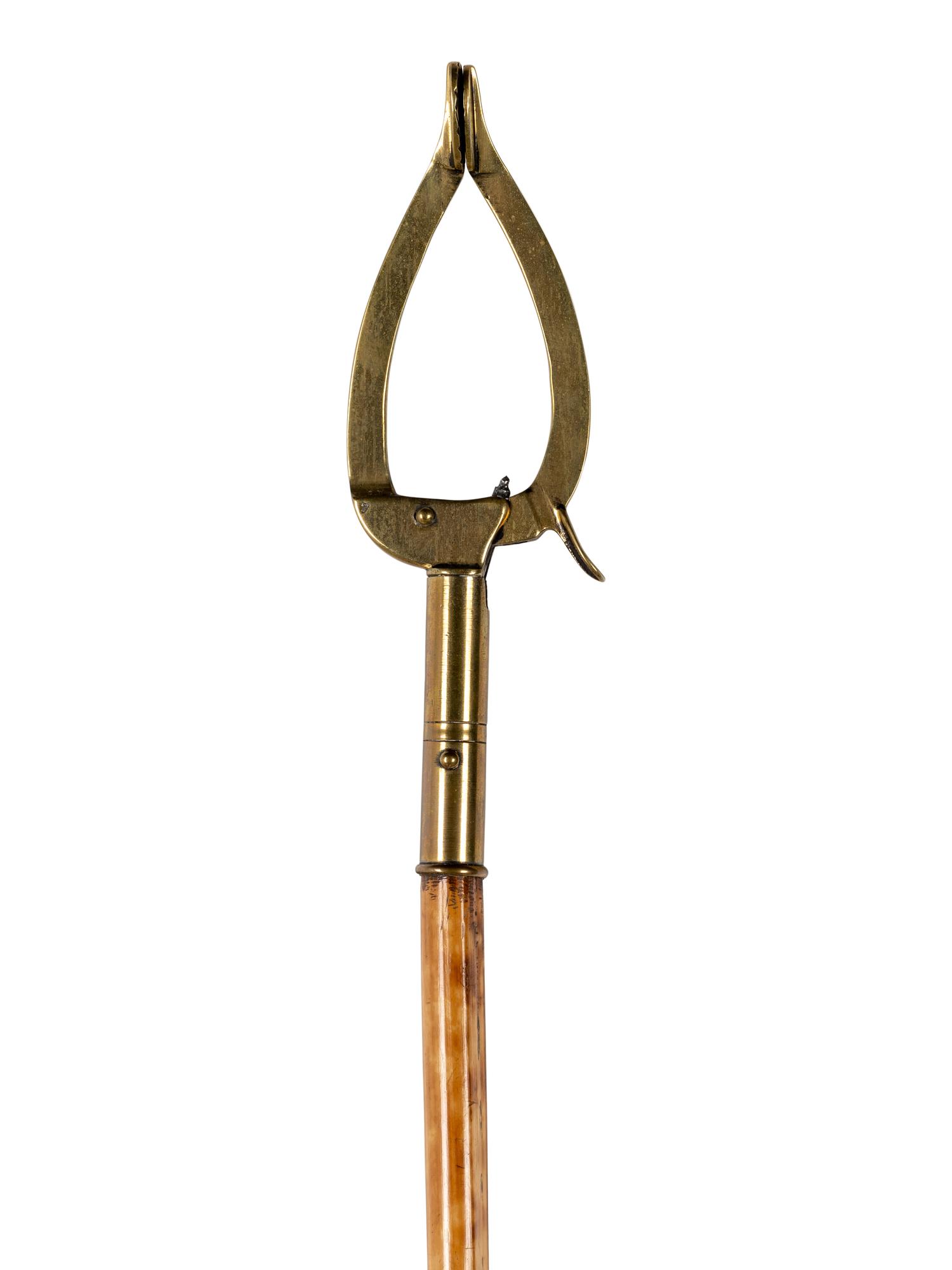 A Victorian Brass Mounted Bamboo Reaching Clamp