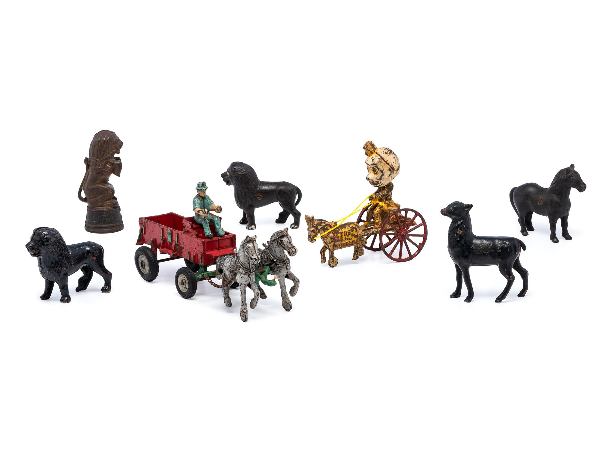 A Group of Cast Iron Banks and Pull Toys