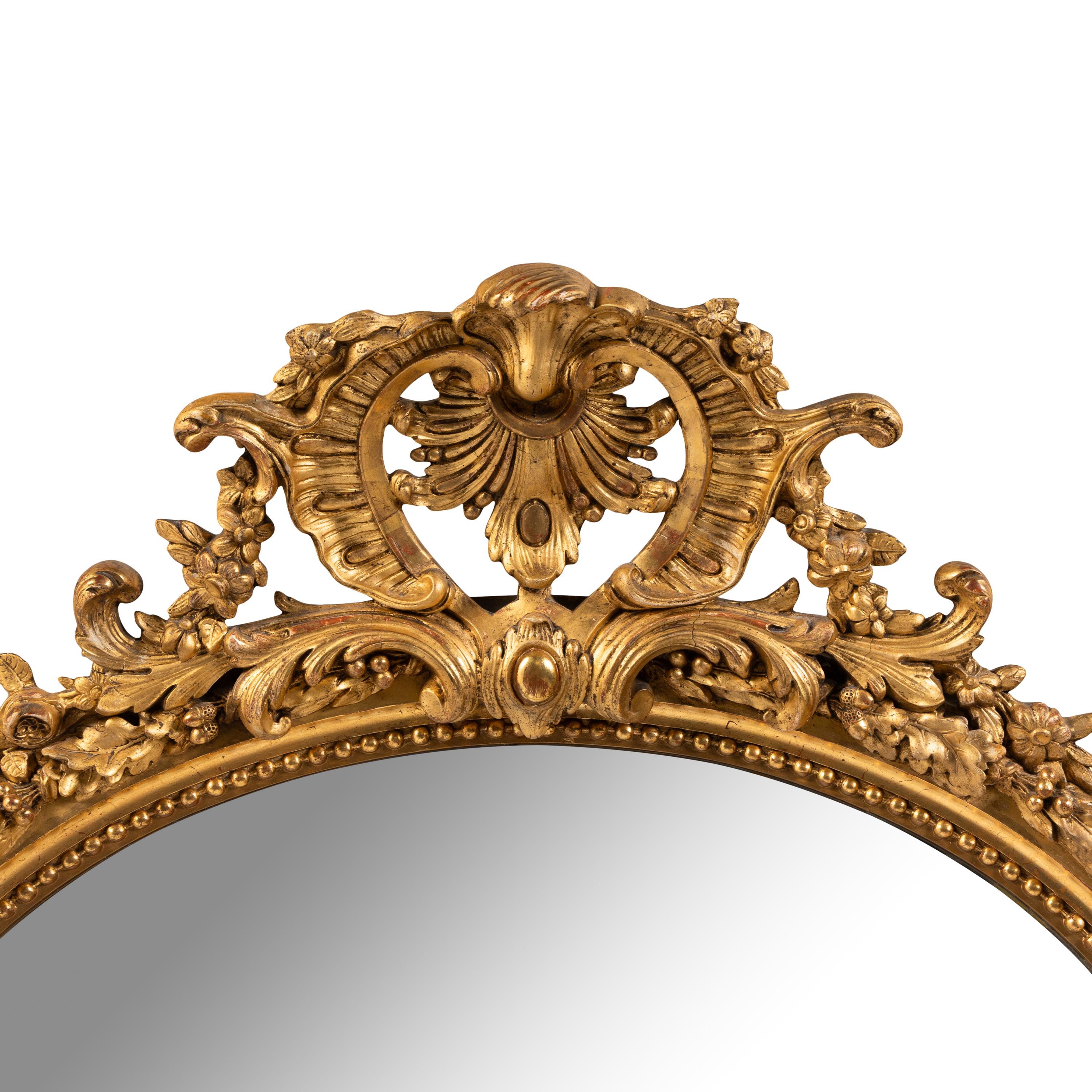 A French Giltwood and Composition Oval Mirror