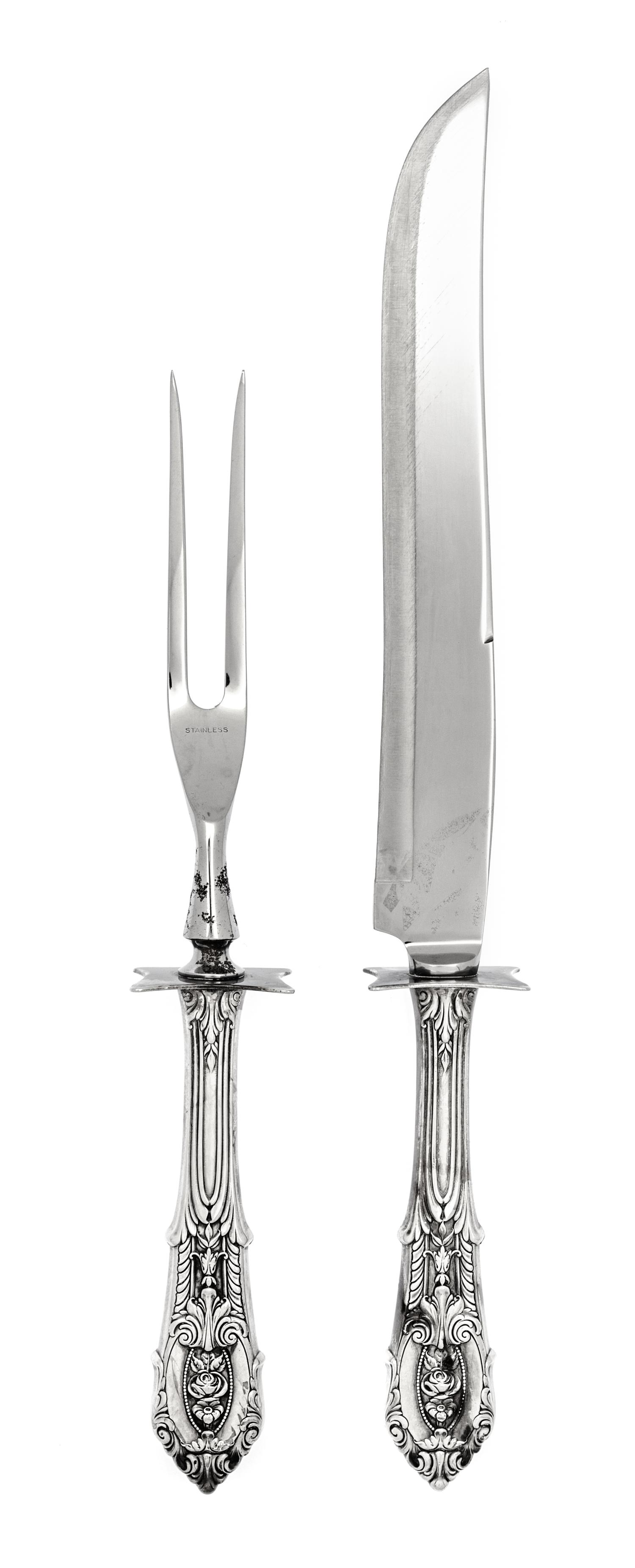 An American Silver-Handled Carving Set, Wallace Silversmiths, Wallingford, CT, comprising a knife and fork with stainless steel impleme
