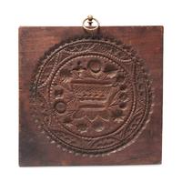 A Carved Walnut Cakeboard