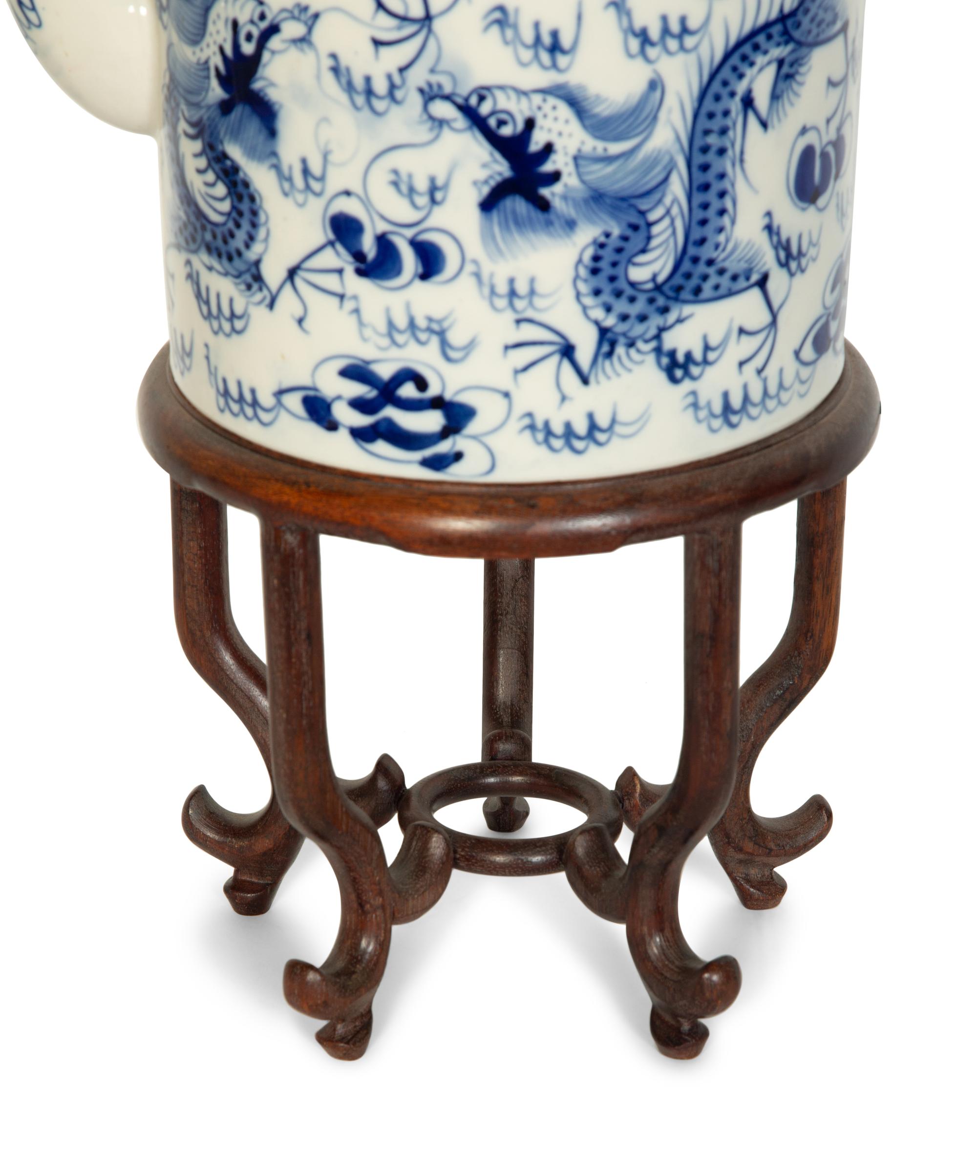 An Oversized Chinese Export Porcelain Teapot Mounted as a Lamp with a Wood Stand