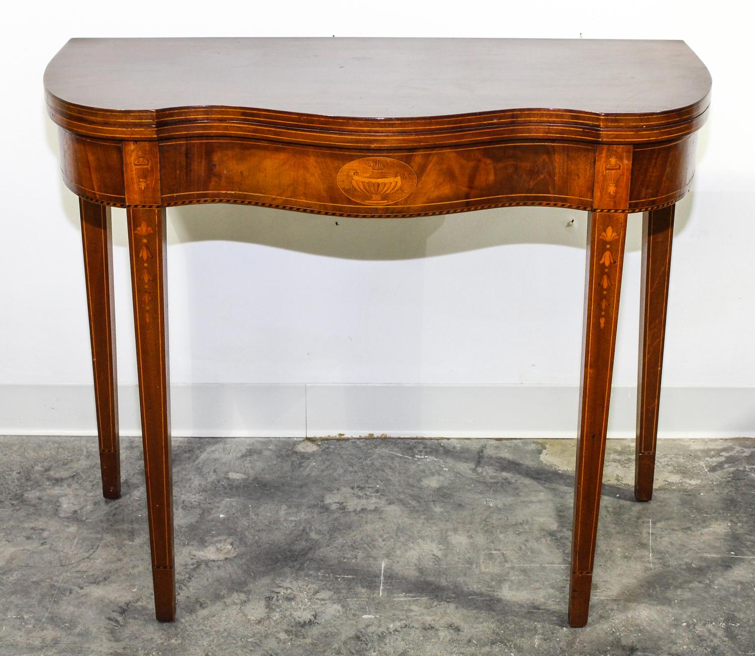 A Marquetry Decorated Mahogany Game Table Height 28 3/4 x width 35 1/2 x depth 17 1/4 inches. — FIRST HALF 20TH CENTURY
