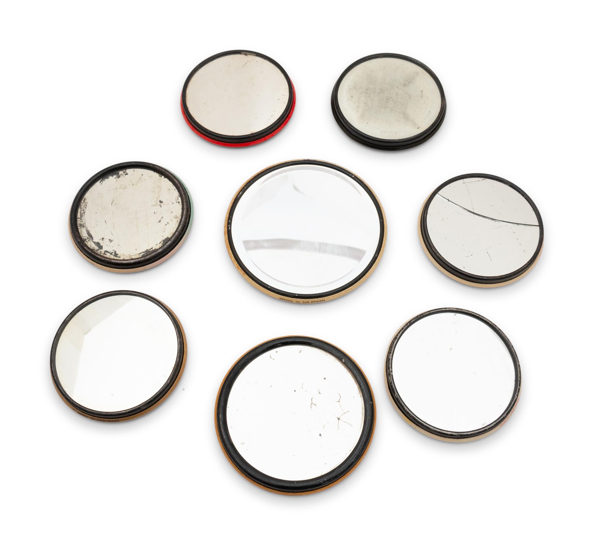 A Collection of Eight Celluloid Advertising Pocket Mirrors