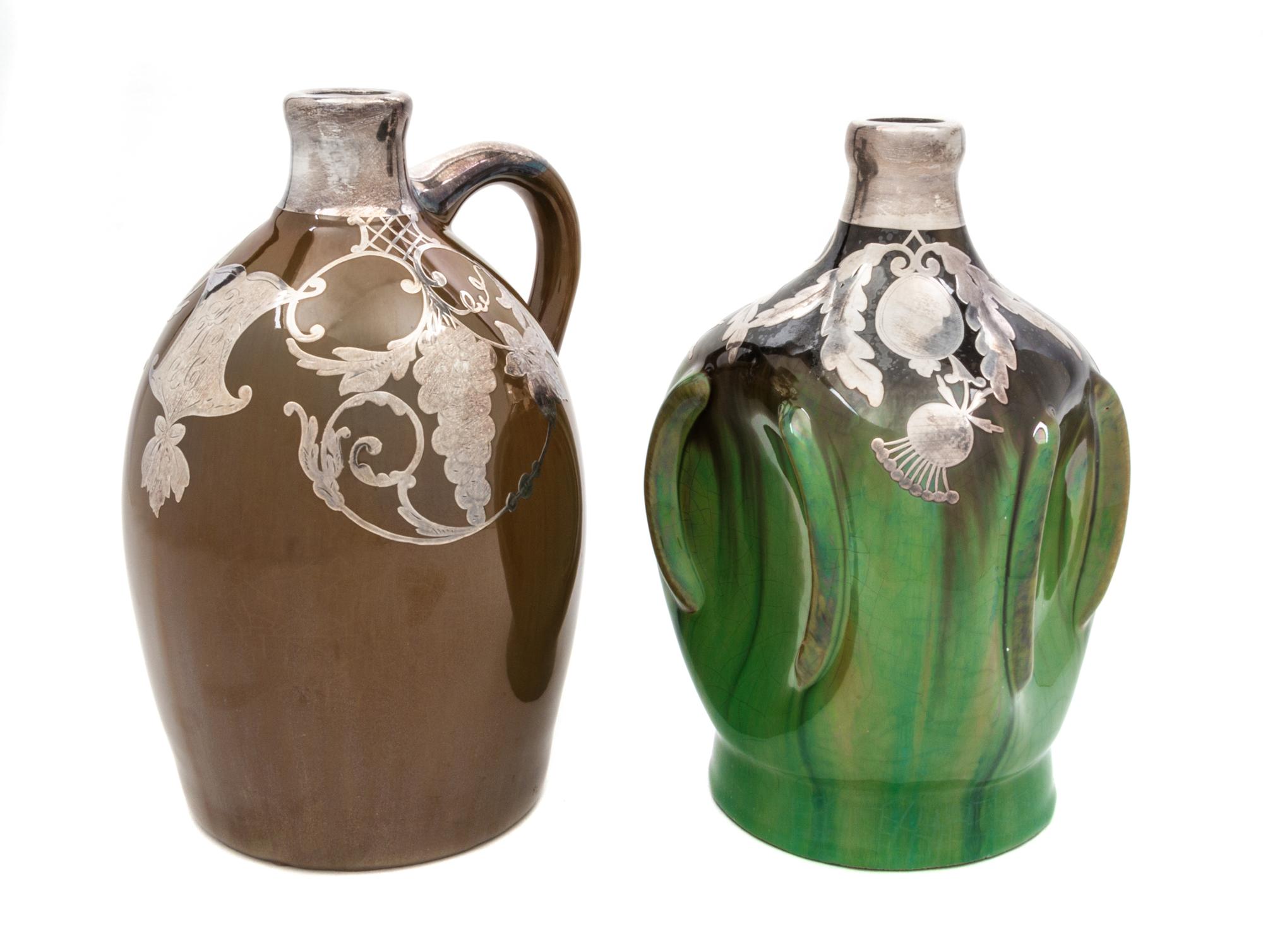 Two Musical Ceramic Silver Overlay Jugs Height of taller 8 7/8 inches.