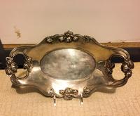 An American Silver Dish, William B. Kerr & Co., Newark, NJ, the handles and rim decorated with floral motifs.