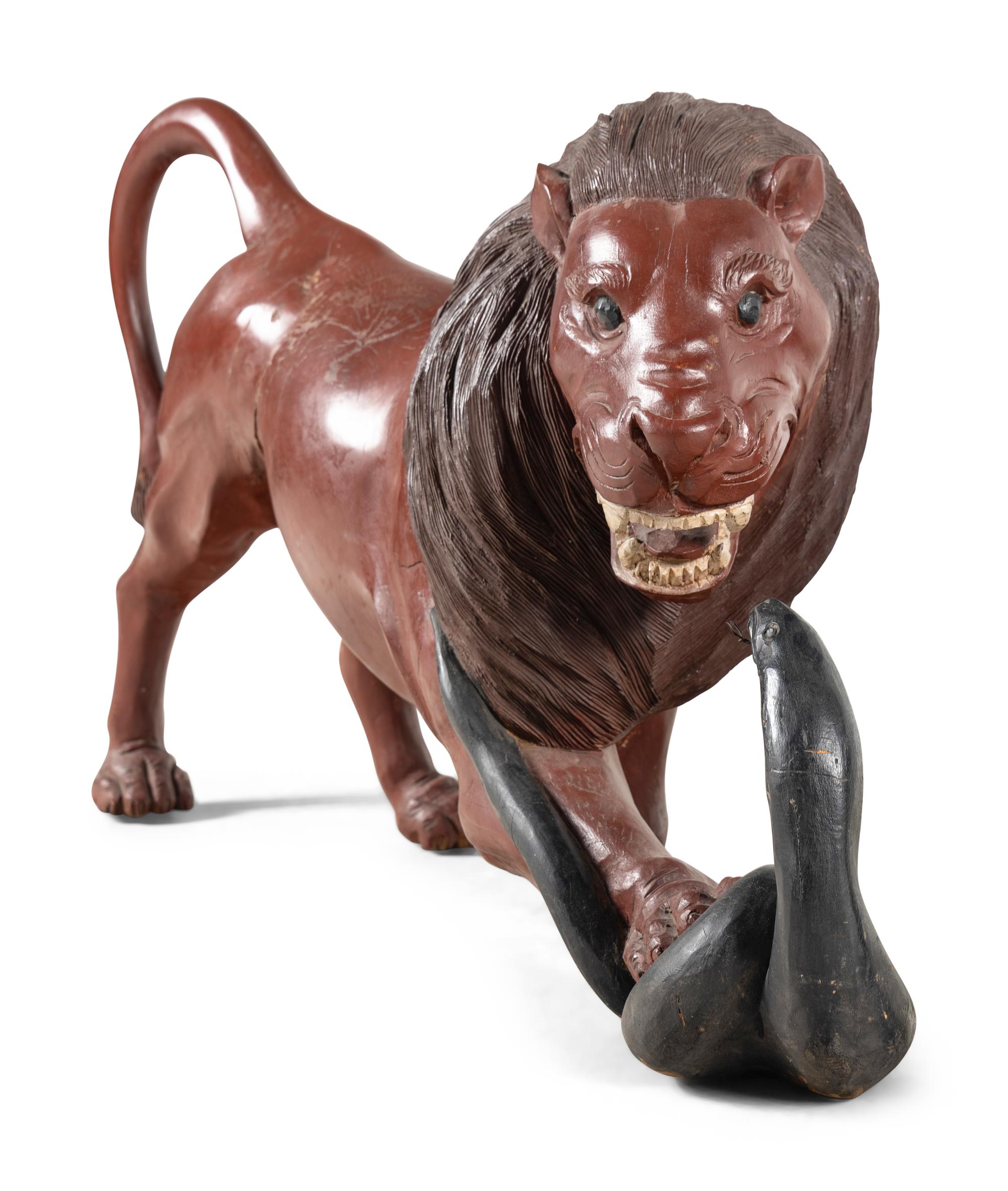 A Pair of Carved and Painted Wood Lions Wrestling Serpents
