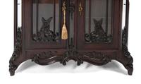 A Pair of Continental Rococo Style Carved Mahogany Vitrine Cabinets