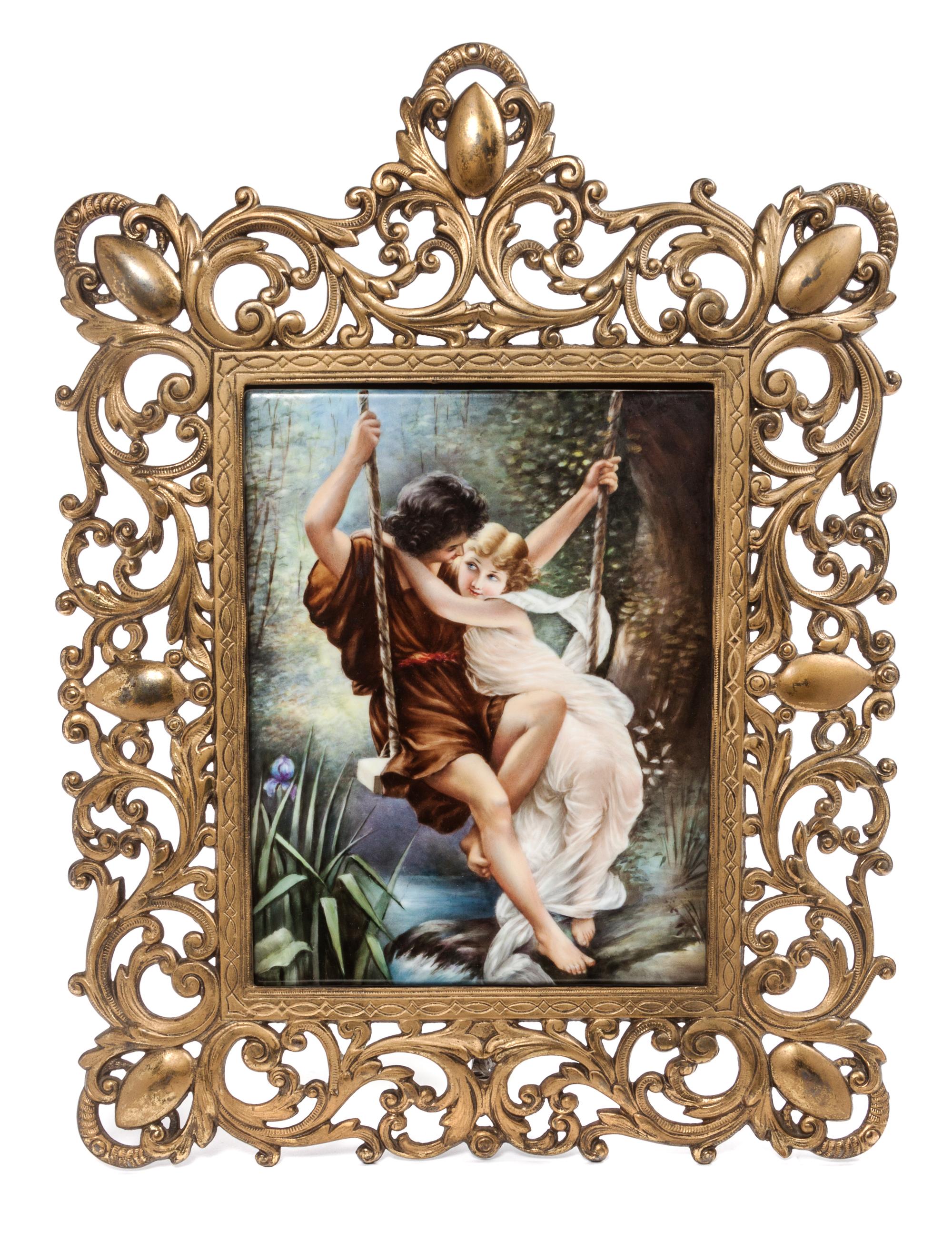 A Continental Porcelain Plaque Frame: 17 1/2 x 13 inches.