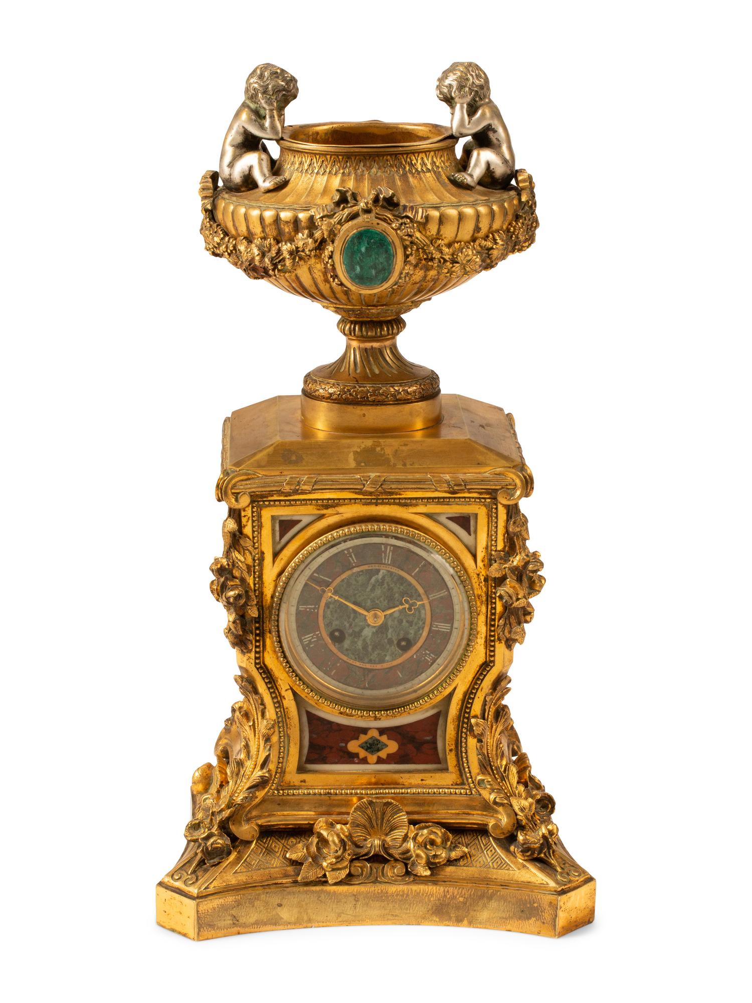 A French Gilt Bronze and Specimen Marble Clock