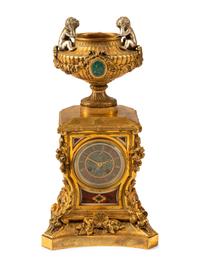 A French Gilt Bronze and Specimen Marble Clock