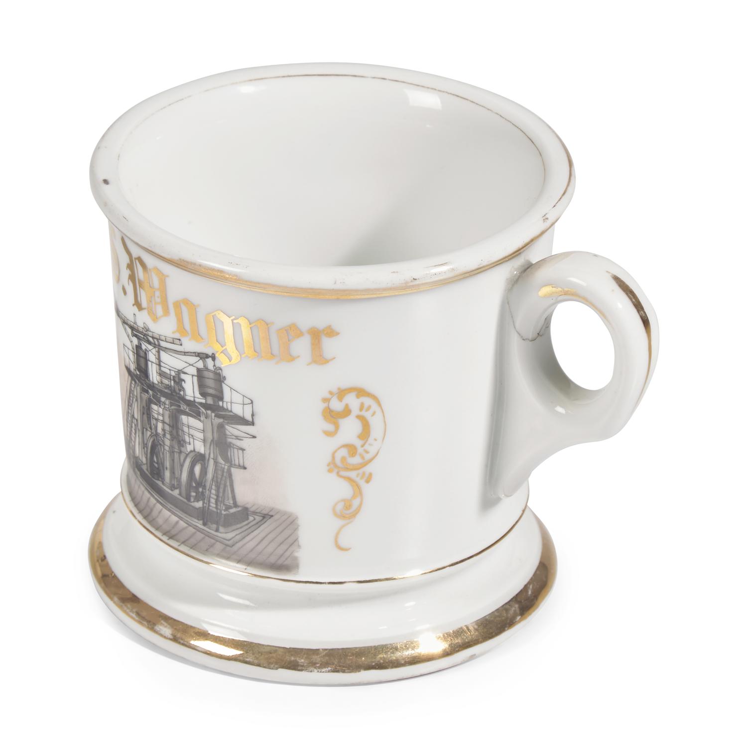 A Gilt and Enamel-Decorated Porcelain Occupational Shaving Mug Depicting the Corliss Steam Engine at Philadelphia Centennial Exposition