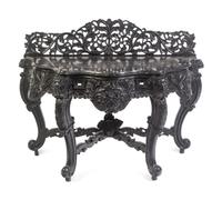An Anglo-Indian Carved and Ebonized Console Table