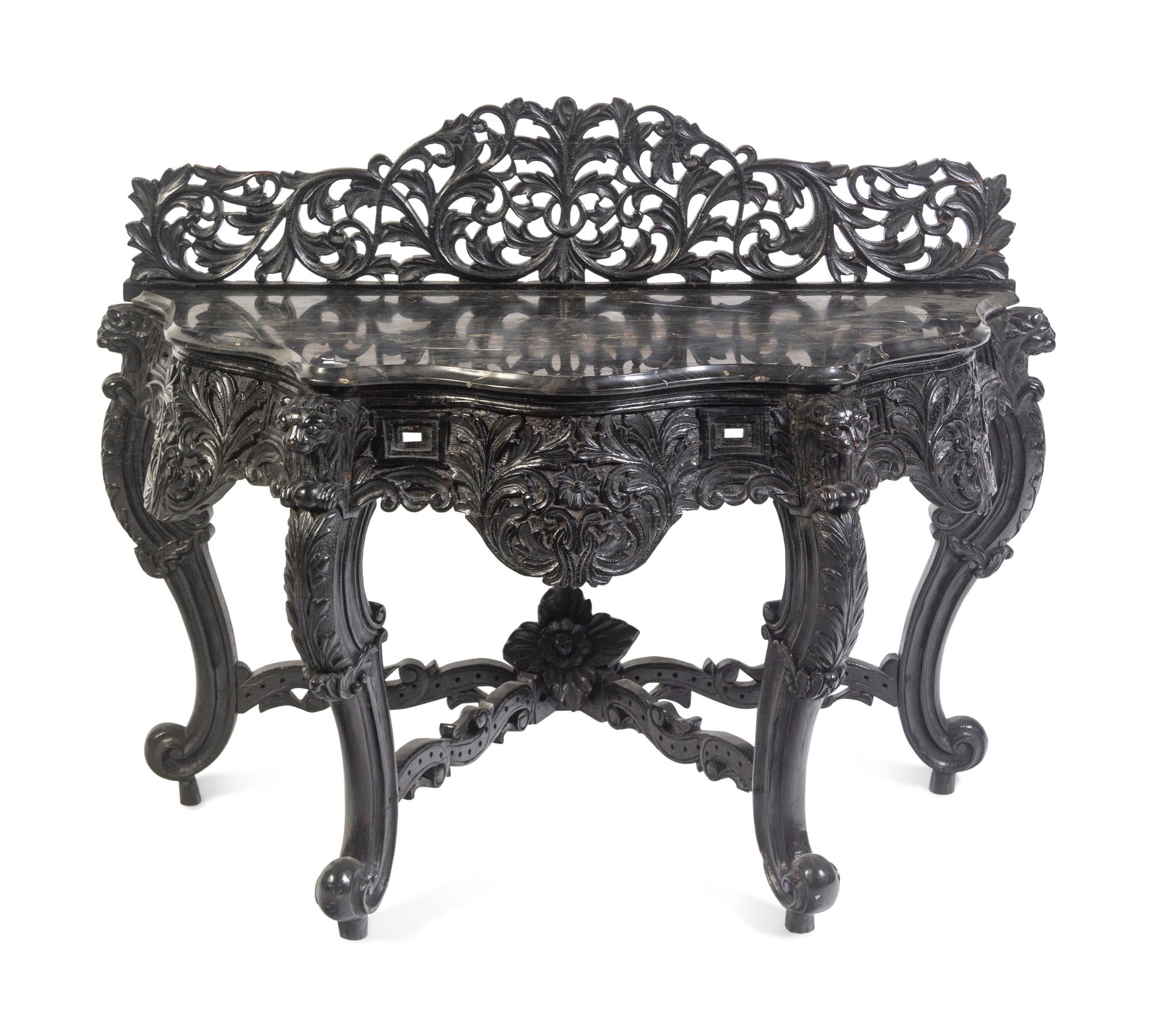 An Anglo-Indian Carved and Ebonized Console Table