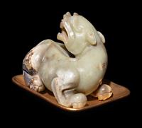 A Chinese Celadon Jade Figure of a Recumbent Bixie