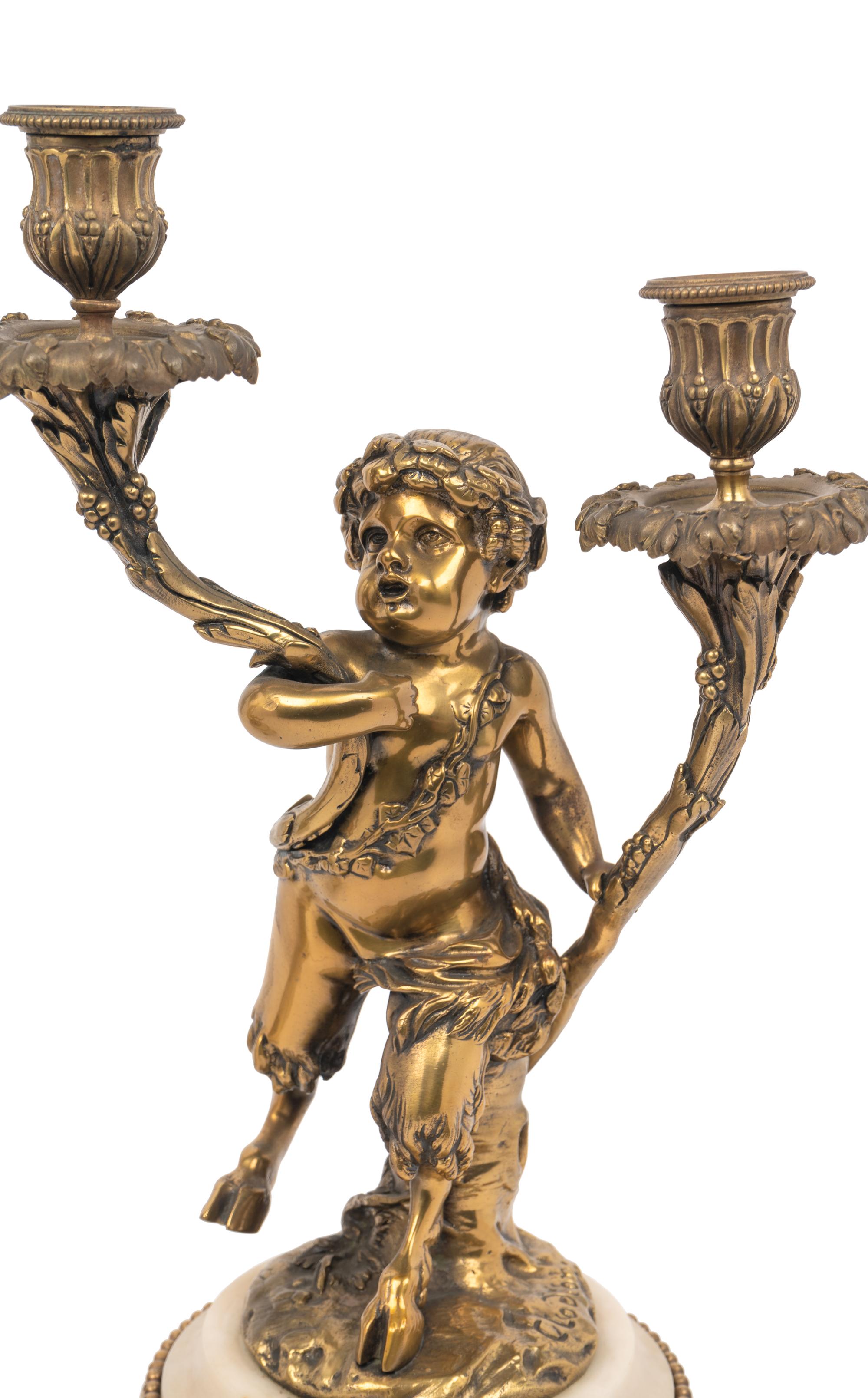 A Pair of French Gilt Bronze and Marble Figural Two-Light Candelabra