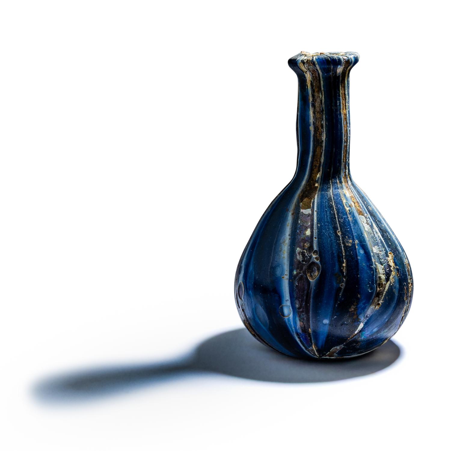 A Roman Marbled Glass Unguentarium