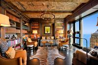 A Pair of Wedgwood Basalt Dolphin Candlesticks