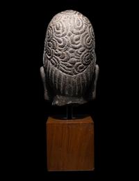 A Khmer Stone Head of Deity