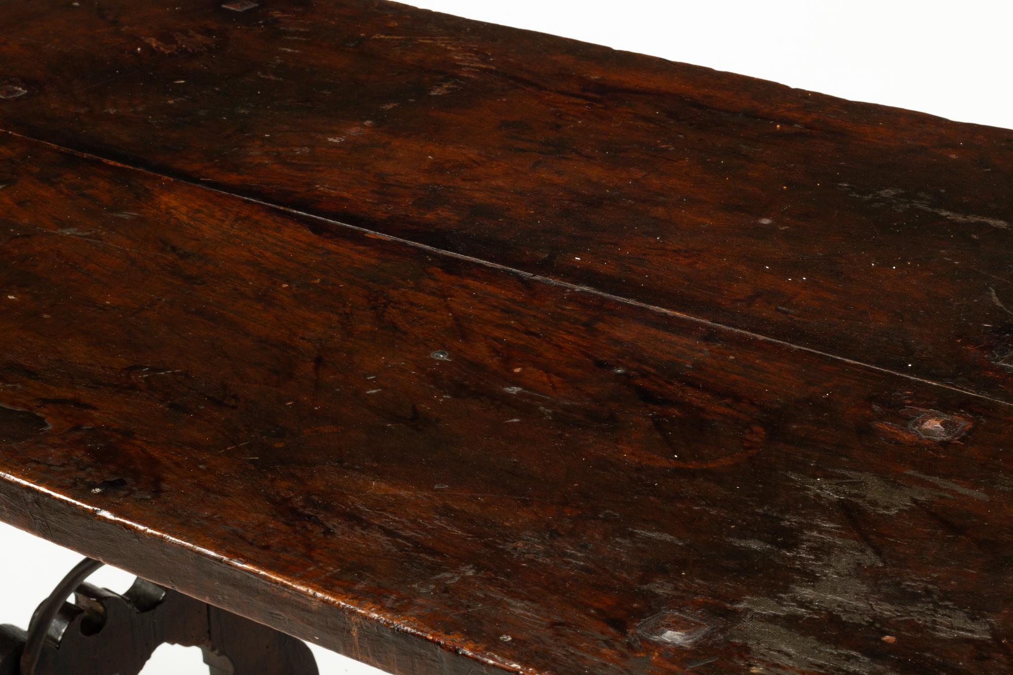 A Spanish Baroque Iron Mounted Walnut Trestle Table