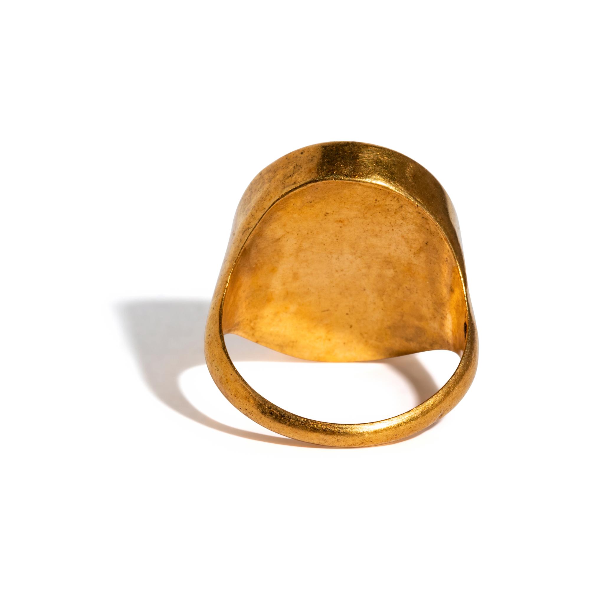 A Neoclassical Gold and Carnelian Finger Ring with the Gods Serapis and Isis