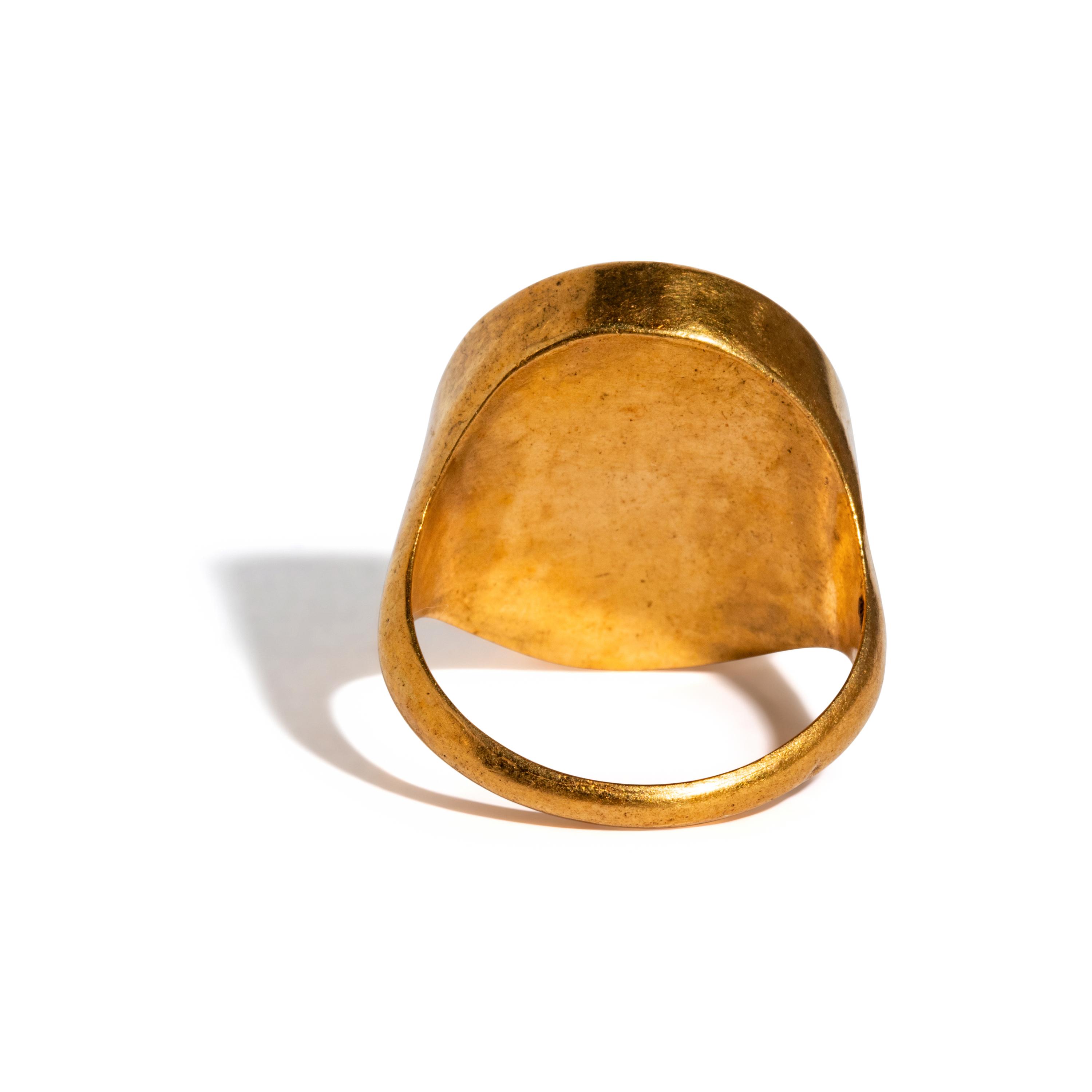 A Neoclassical Gold and Carnelian Finger Ring with the Gods Serapis and Isis