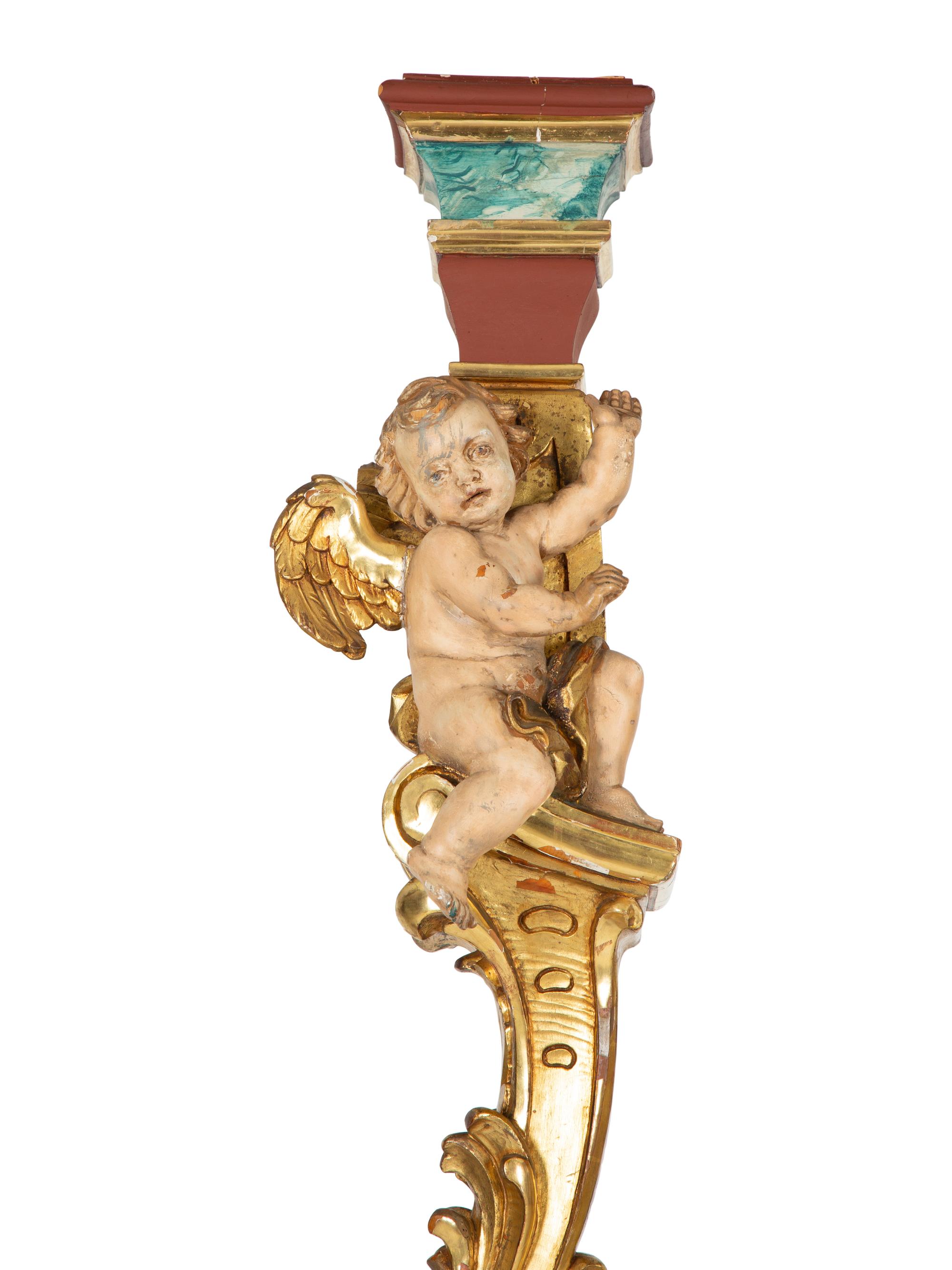 A Pair of Venetian Painted and Parcel Gilt Columns with Putti