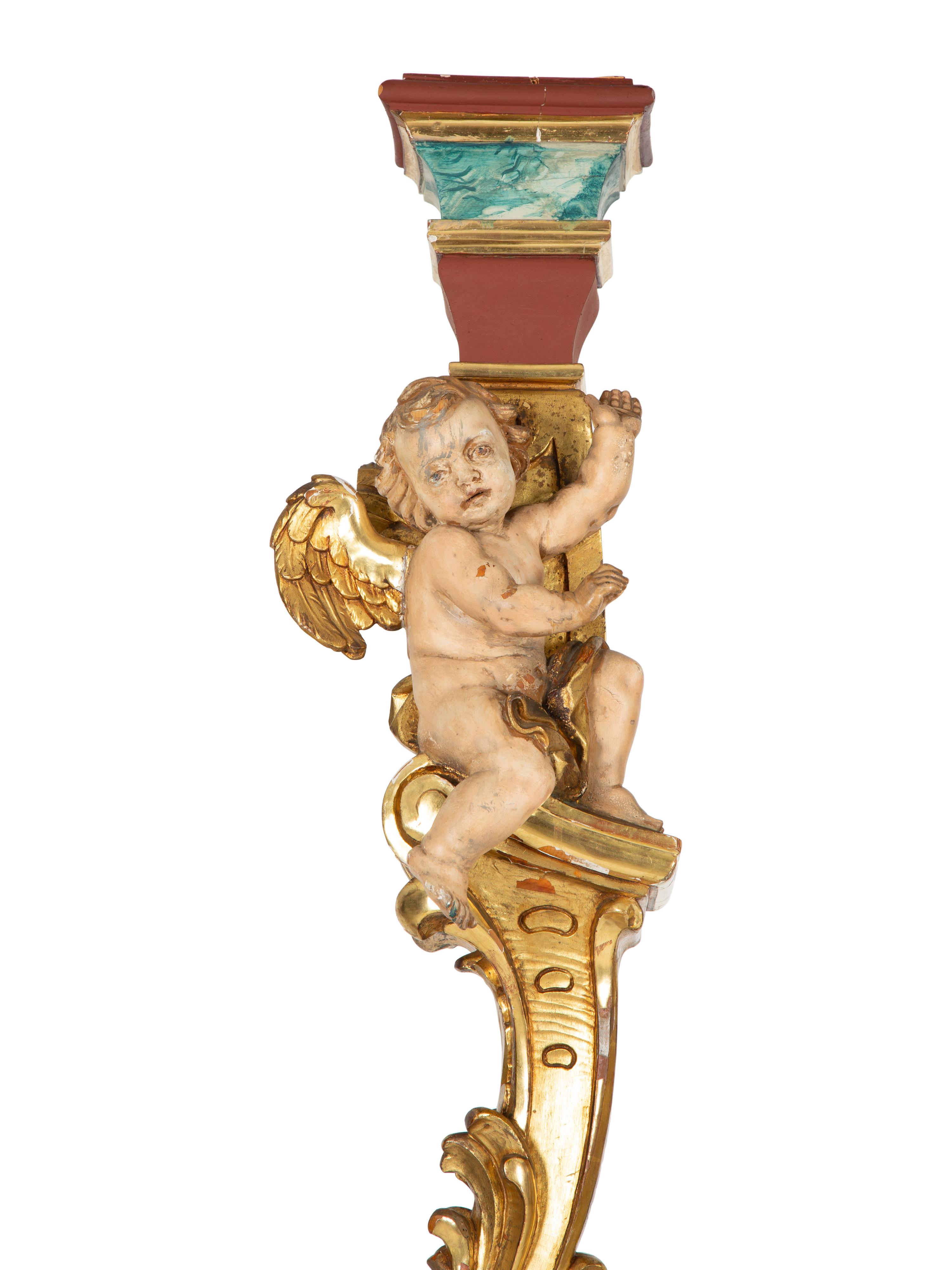 A Pair of Venetian Painted and Parcel Gilt Columns with Putti
