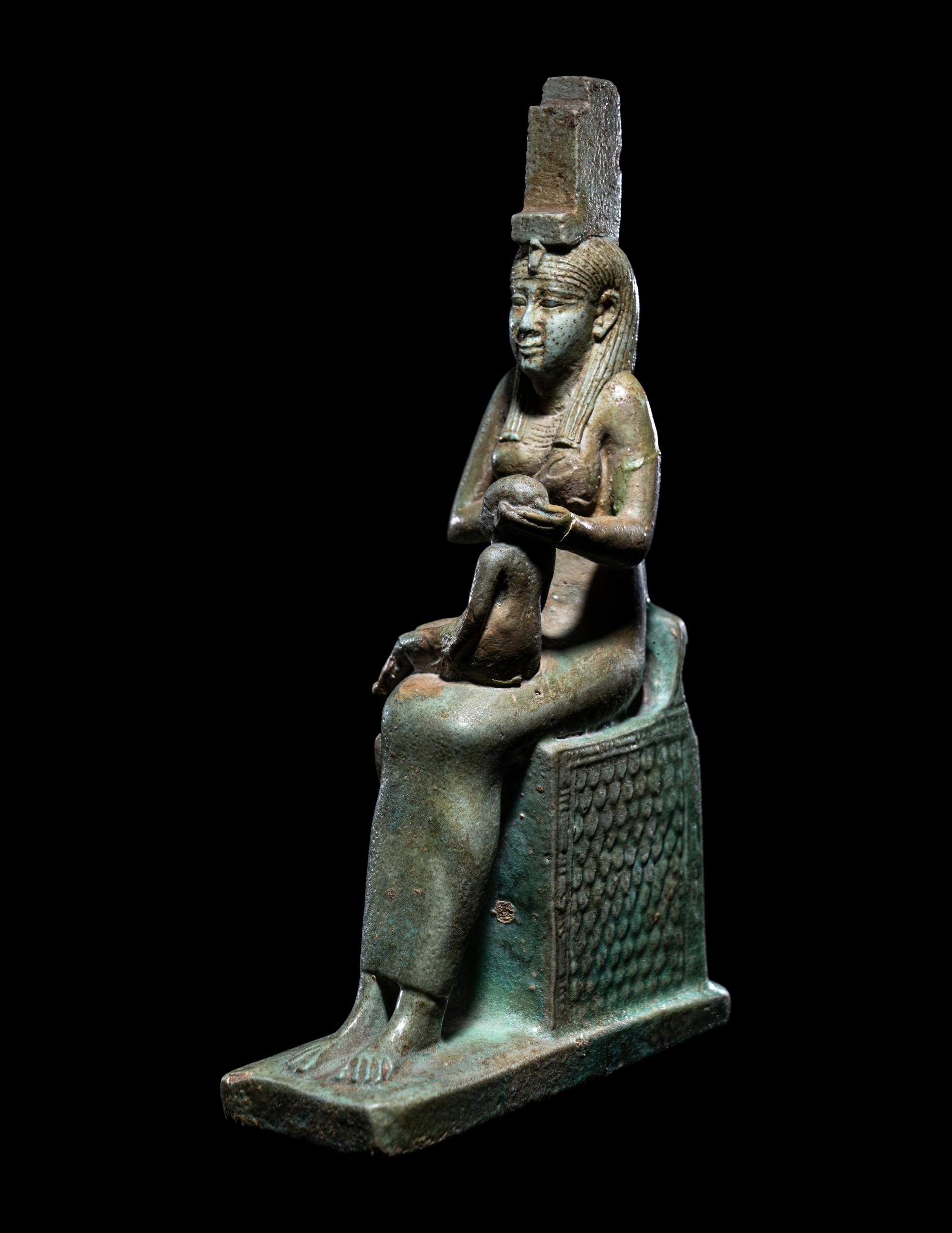 An Egyptian Faience Isis Nursing Harpocrates