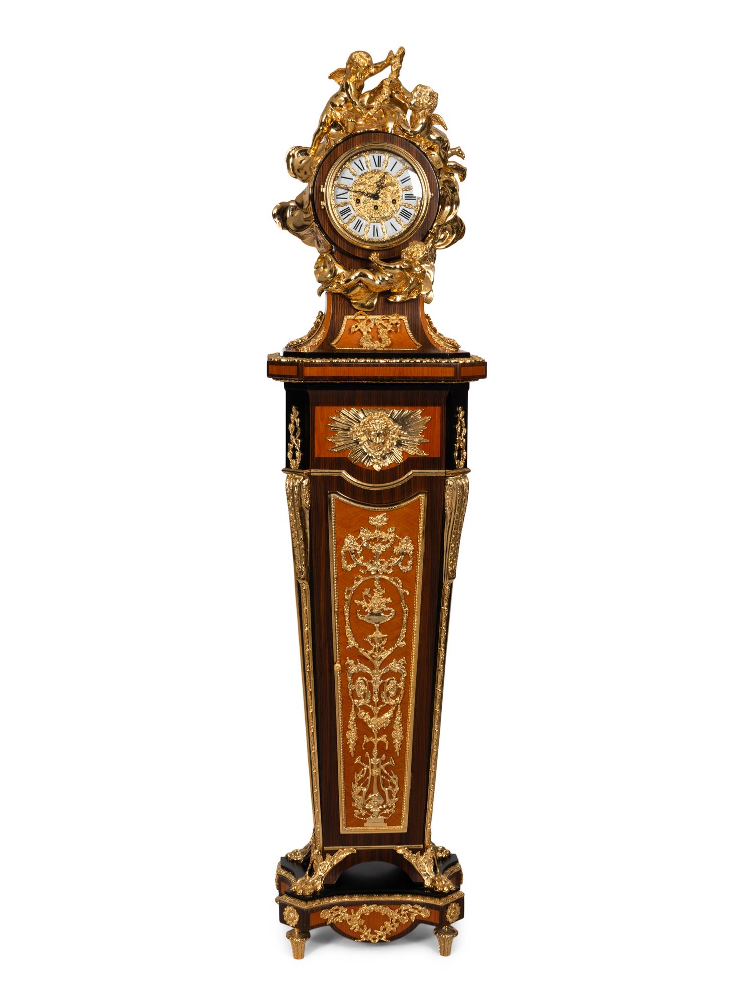 A Louis XVI Style Gilt Bronze Mounted Rosewood and Palisander Parquetry Longcase Clock