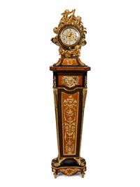 A Louis XVI Style Gilt Bronze Mounted Rosewood and Palisander Parquetry Longcase Clock