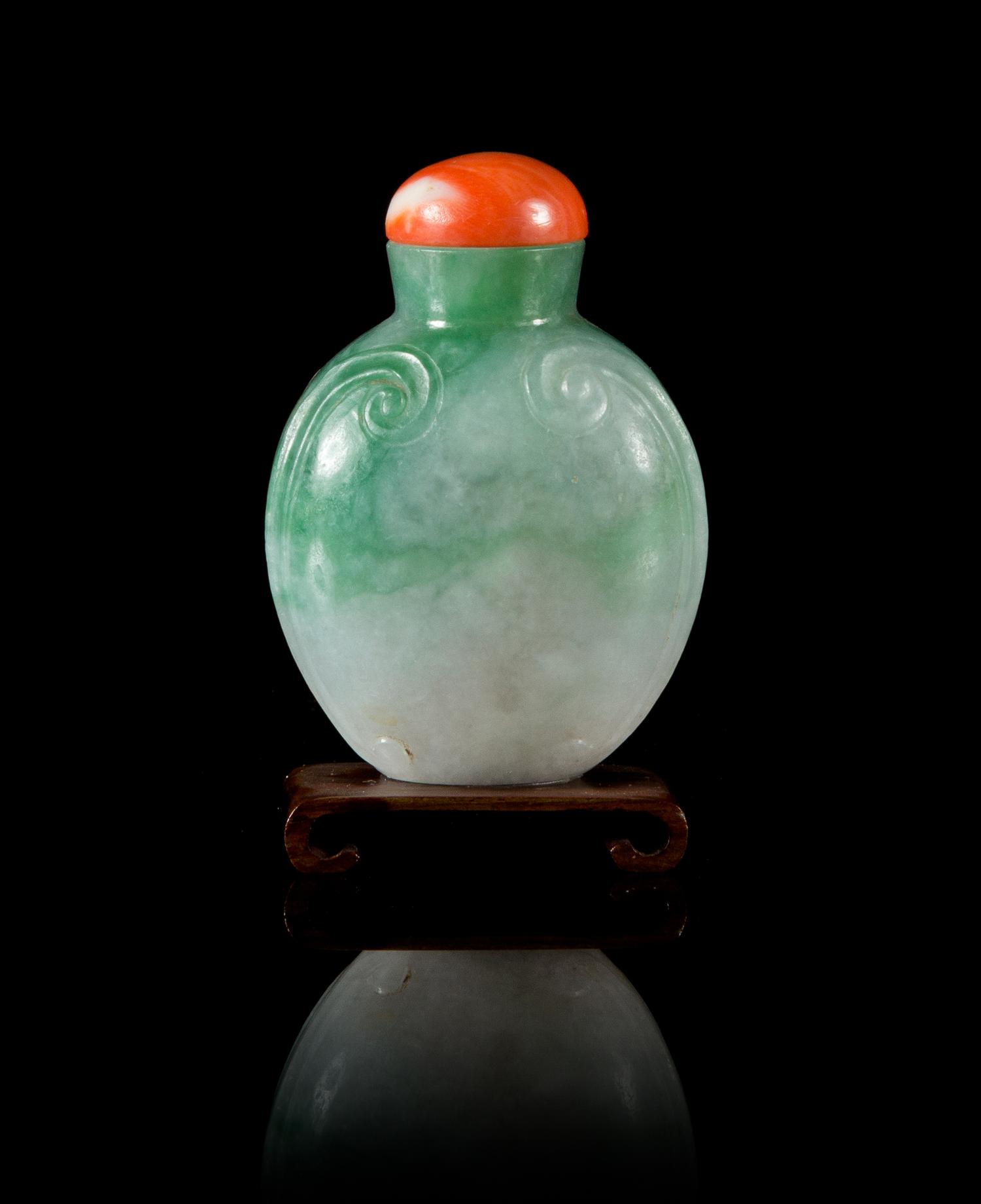 An Apple Green and Celadon Jadeite Snuff Bottle Height 2 1/2 inches.