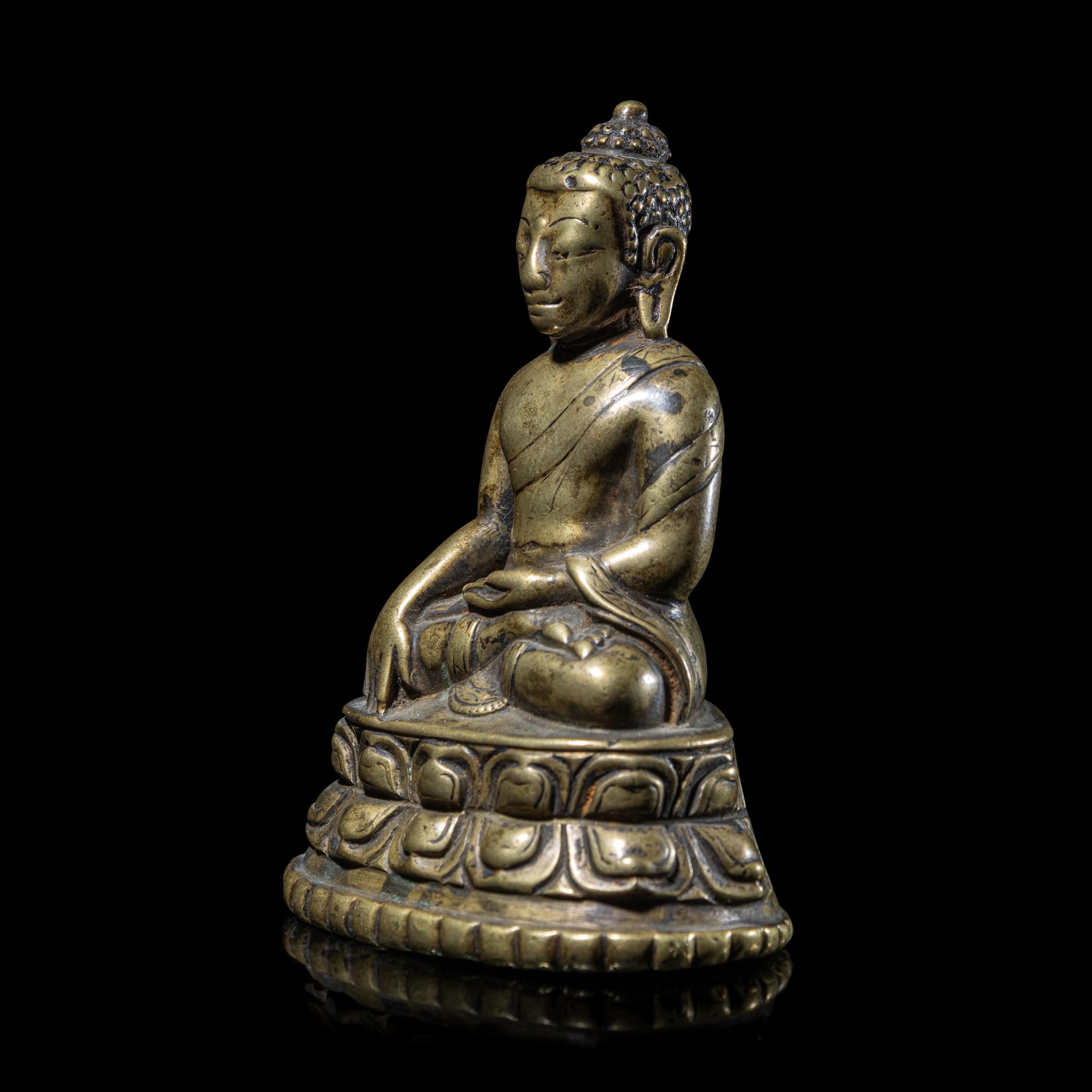 A Tibetan Copper Alloy Figure of Buddha Shakyamuni, 14th/15th Century 十四/十五世紀 西藏銅坐佛