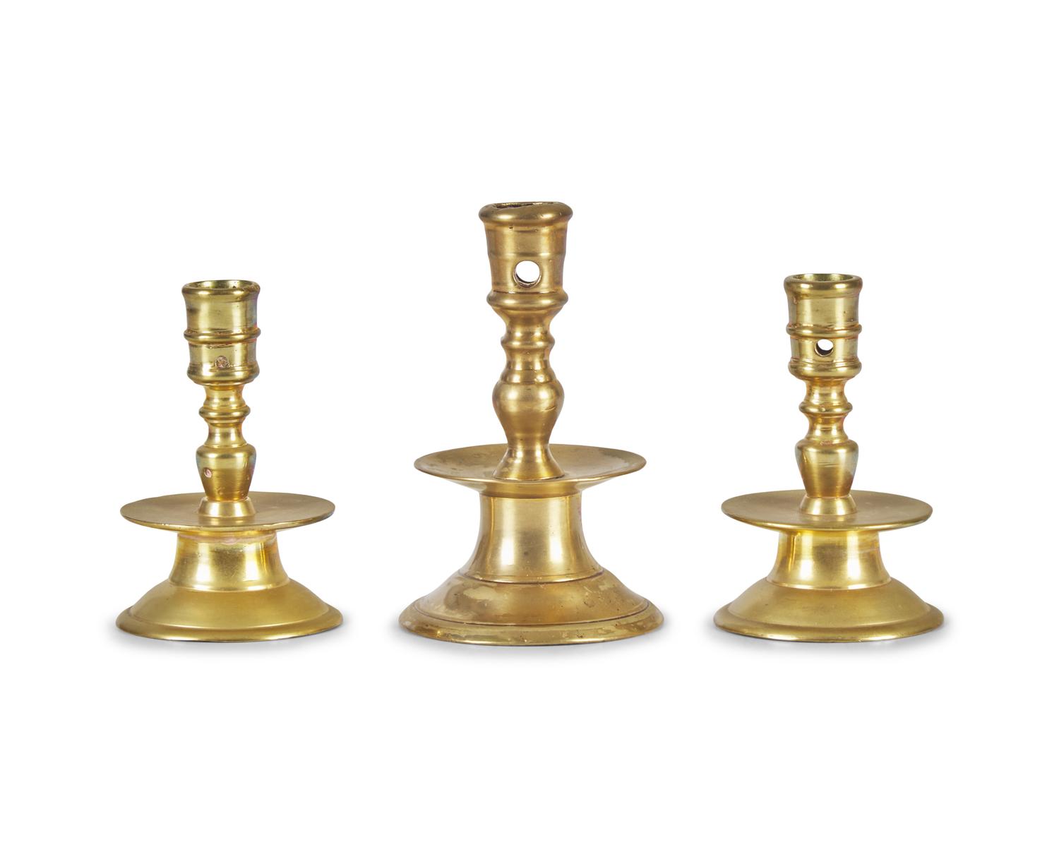 A Group of Three Dutch Brass Candlesticks