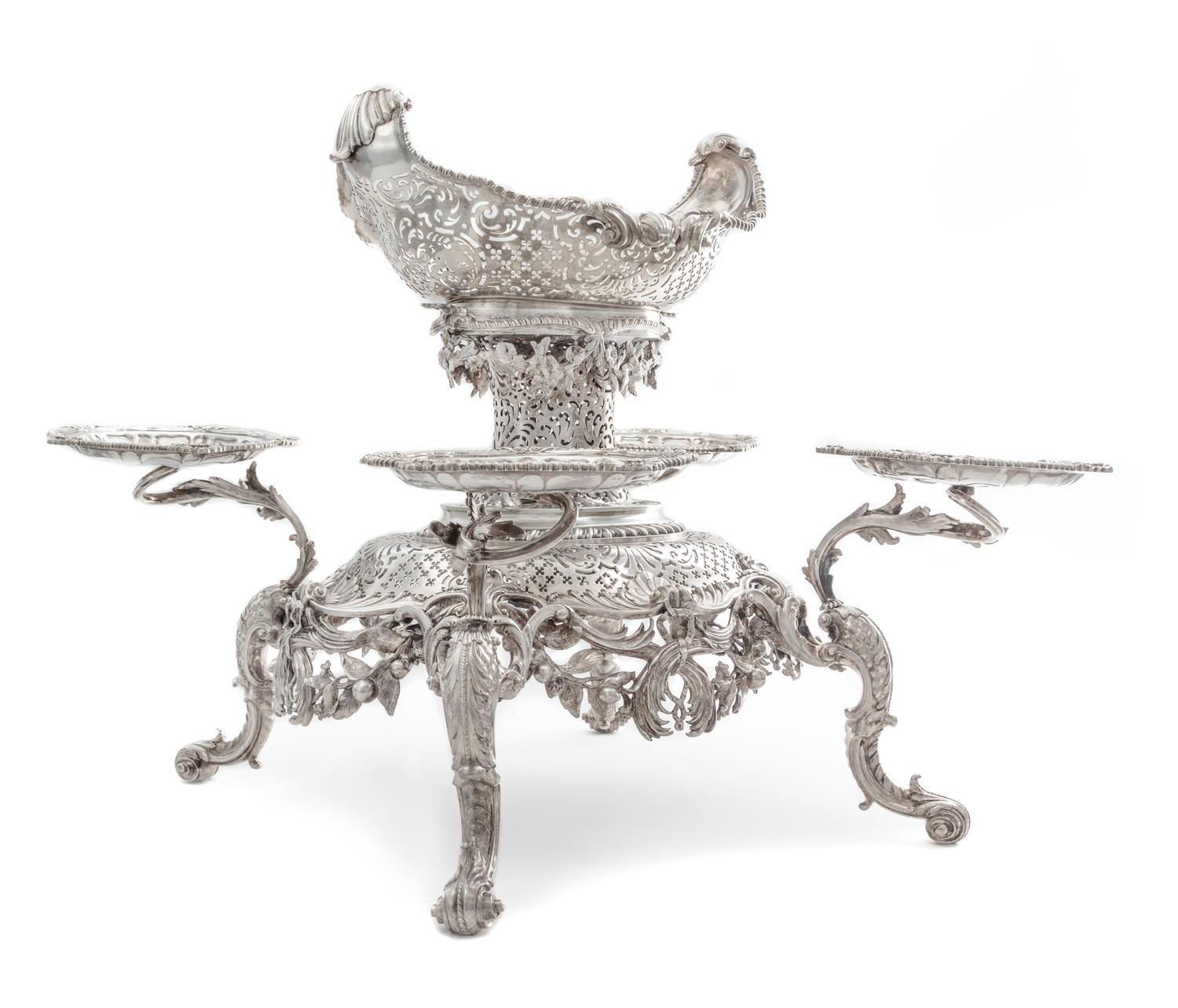 A George II Silver Epergne, Peter Archambo II & Peter Meure, London, 1753, the central basket of oval form with twin-foliate handles an