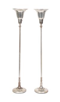 A Pair of Silver Torcheres Height 67 inches.