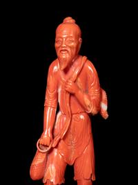 A Chinese Red Coral Figure of a Fisherman