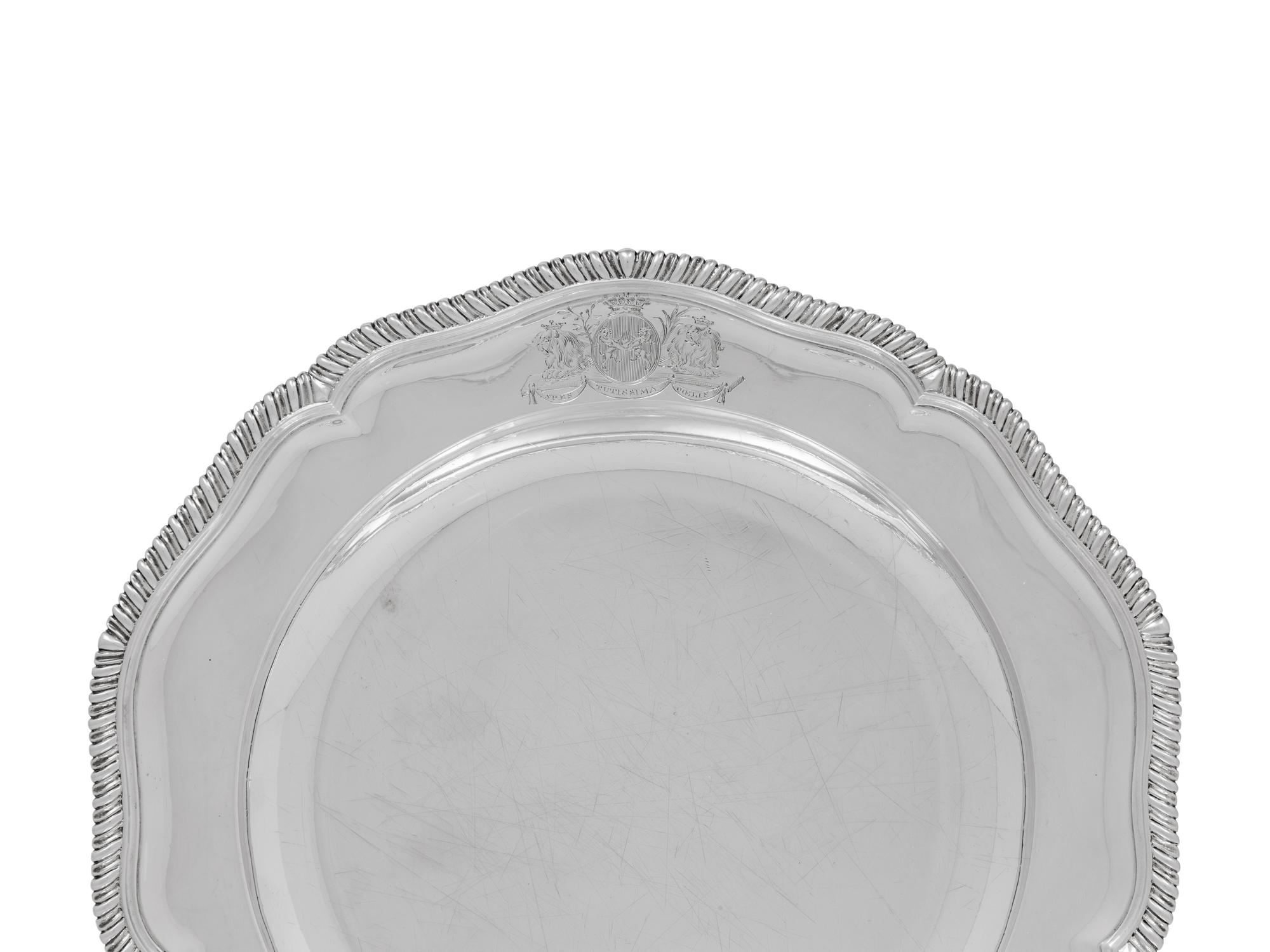 A Set of Ten George III Silver Dinner Plates