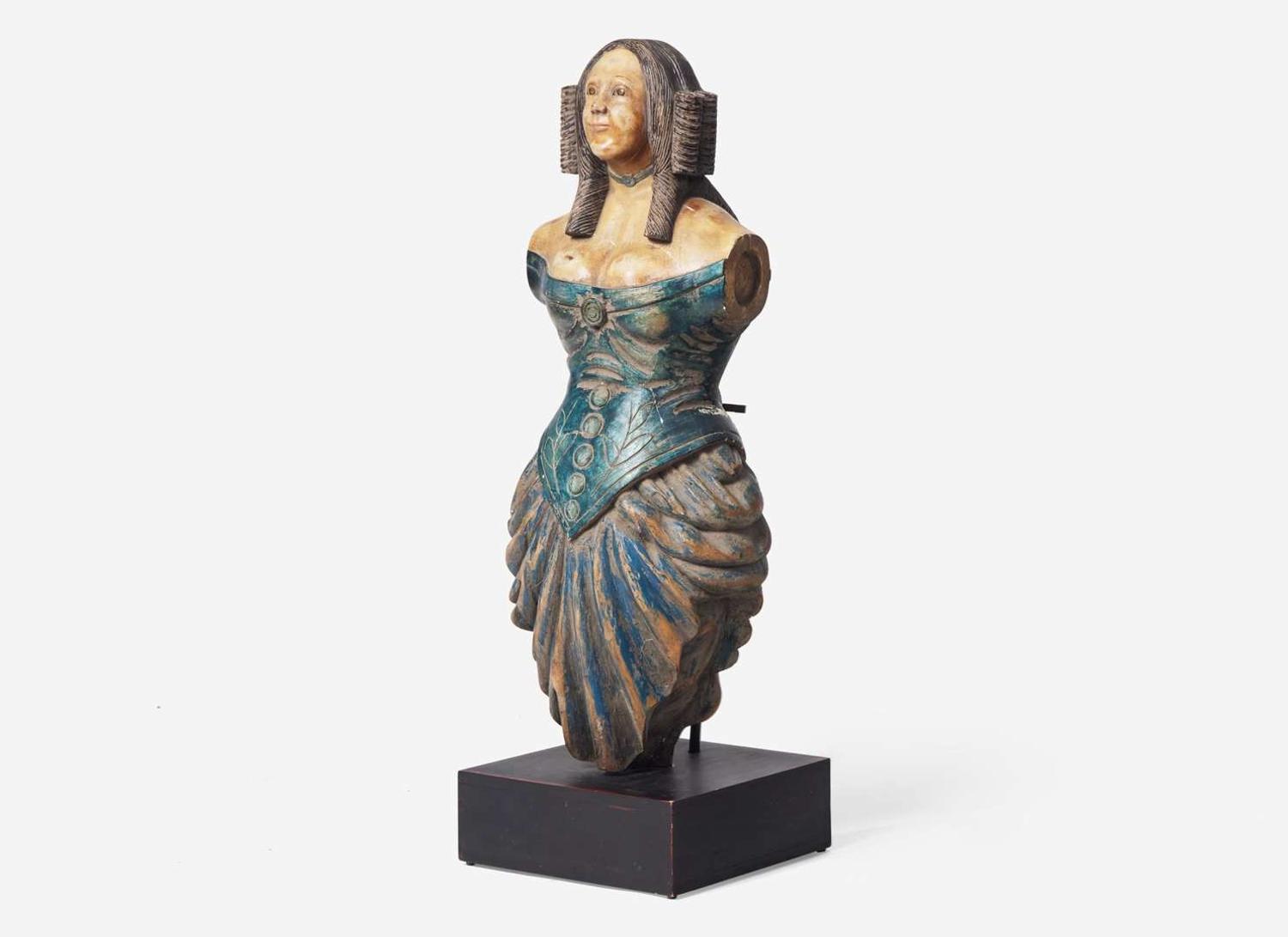 A carved and painted trade figure of a lady, likely 20th century